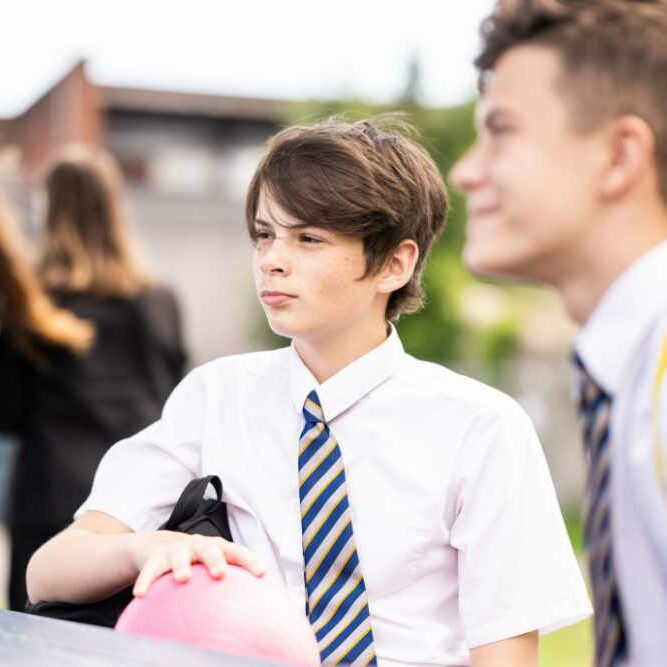 Boys listening to someone talking